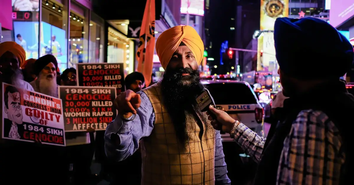 A man in a crowd, representing collective action and advocacy for positive change.